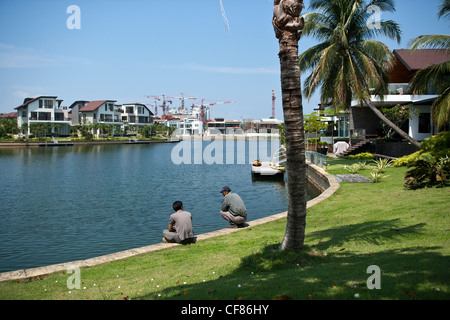 Waterfront luxury homes and condominium apartments are seen at Sentosa Cove in Singapore. Stock Photo