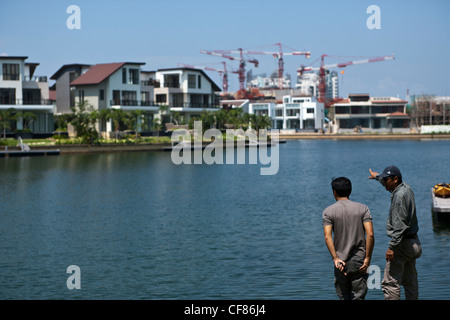 Waterfront luxury homes and condominium apartments are seen at Sentosa Cove in Singapore. Stock Photo