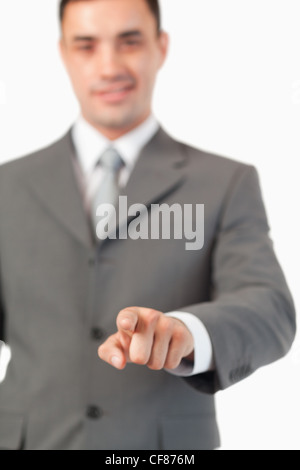 Portrait of a businessman pressing an invisible key Stock Photo