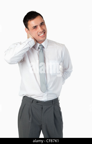 Portrait of a young businessman having a back pain Stock Photo