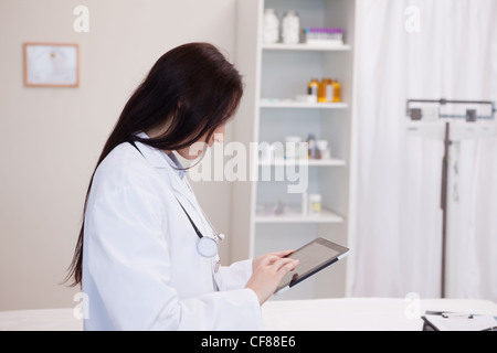Doctor using a tablet computer Stock Photo