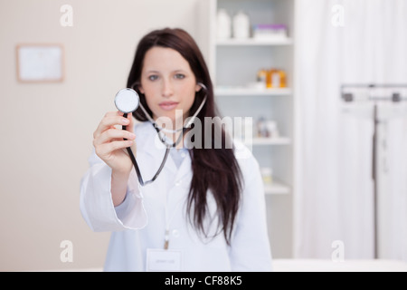 Female doctor using stethoscope Stock Photo