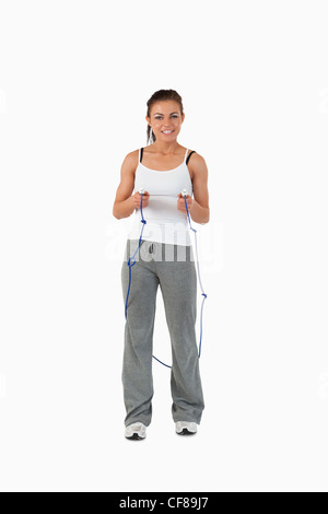 Young female about to start jump roping Stock Photo - Alamy
