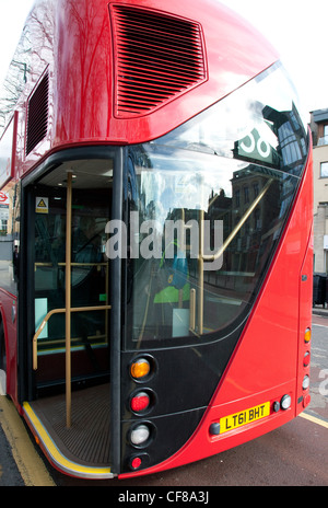 New Routemaster at bus stop, London - open rear platform Stock Photo