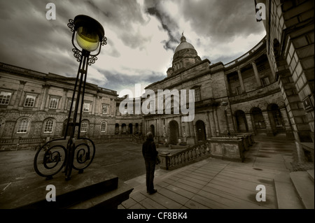 Moody dusk view of the University of Edinburgh Old College buildings and Talbot Rice Gallery at South College Street and South Bridge in Edinburgh Stock Photo
