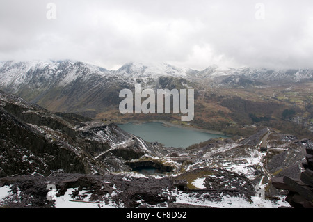 Disused buildings and waste slate over looking Llyn Peris in at Dinorwig quarry in Llanberis North Wales Stock Photo