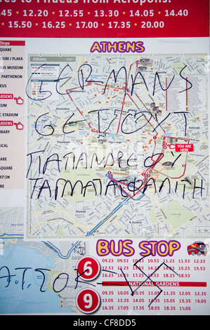 Offensive anti German graffiti in a bus stop outside the Greek parliament in Athens, Greece Stock Photo