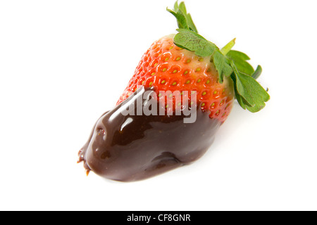 A picture of a single strawberry dipped in melted chocolate Stock Photo
