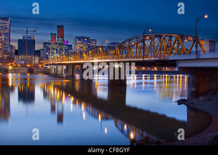 Hawthorne Bridge Over Willamette River In Portland Oregon Downtown Waterfront at Blue Hour Stock Photo
