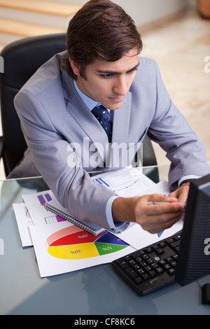 Businessman analyzing statistics Stock Photo