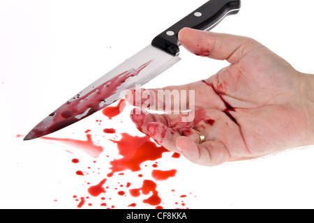 a knife smeared with blood. a murder weapon. symbolfoto crime Stock Photo