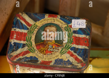 Antique tin bearing an image of Lord Kitchener on a Union Jack background Stock Photo