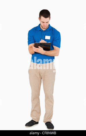 Young salesman making notes Stock Photo