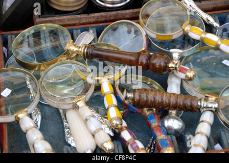 Antique magnifying glasses on a stall Stock Photo