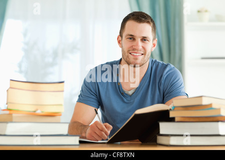 Smiling student preparing for exam Stock Photo