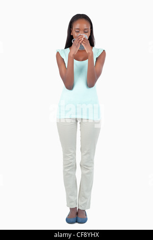 Young woman enjoying a sip of coffee Stock Photo