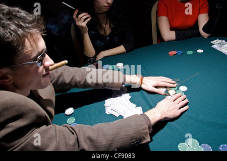 Young Caucasian guy had won the poker round Stock Photo