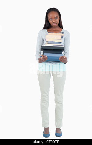 Young woman with a books pile Stock Photo - Alamy