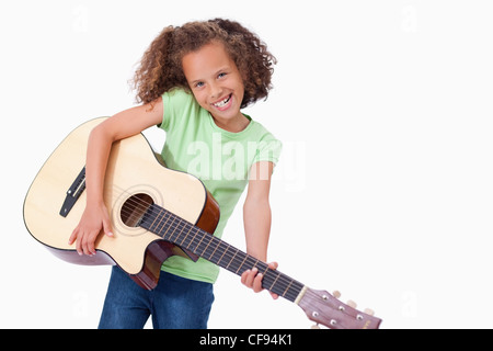 Happy girl playing the guitar Stock Photo