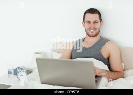 Young man using a notebook Stock Photo
