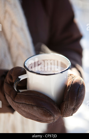 Mug and thermos of hot chocolate on a cold winter day Stock Photo - Alamy