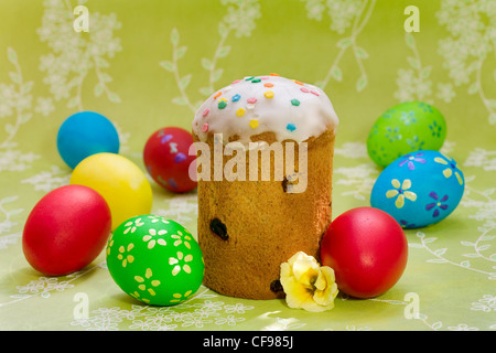 Easter cake with glace icing and colored easter eggs Stock Photo