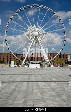 There is a large ferris wheel, Liverpool's Big Wheel, in the piazza outside the Echo Arena in the city. Stock Photo