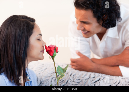 Man just gave his girlfriend a rose Stock Photo