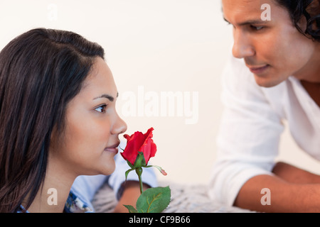 Male just gave his girlfriend a rose Stock Photo