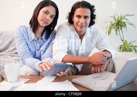 Couple paying their bills online Stock Photo