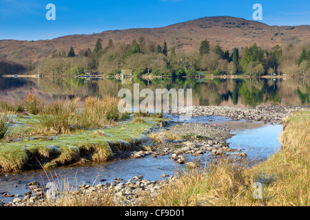 Looking across Coniston Water in the English Lake District on a bright, calm, early spring morning. Stock Photo