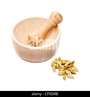 Pestle and mortar with cardomon seeds Stock Photo