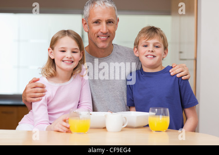 Father posing with his children in the morning Stock Photo