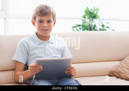 Happy boy using tablet computer Stock Photo
