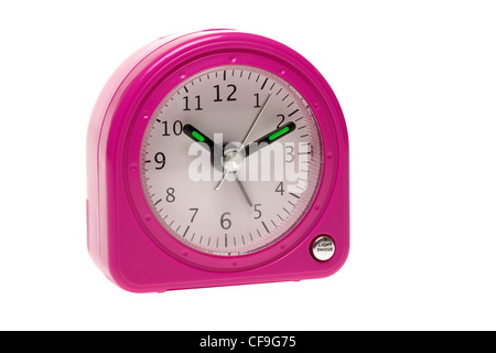 Small pink battery operated alarm clock Stock Photo