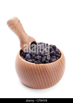 Wooden scoop in bowl full of dry barberry isolated on white background Stock Photo