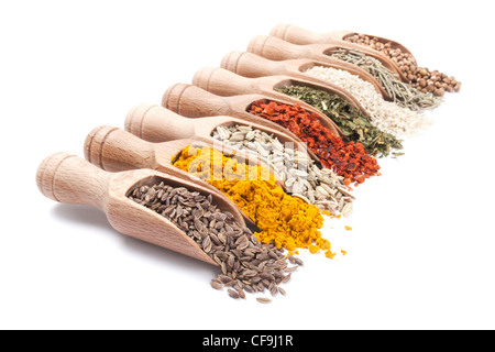 Row of wooden shovels with spices in them. Diminishing perspective Stock Photo