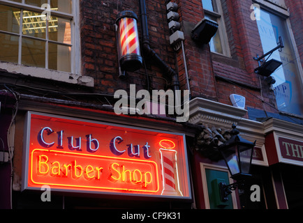 Illuminated barbers sign in Matthew Street, ( Cavern Walks ) in Liverpool. Stock Photo