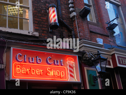 Illuminated barbers sign in Matthew Street, ( Cavern Walks ) in Liverpool. Stock Photo