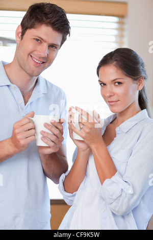 Portrait of a couple drinking tea Stock Photo