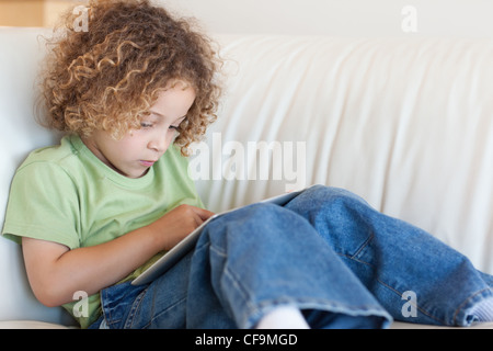 Boy using a tablet computer Stock Photo