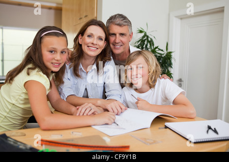Family doing homework Stock Photo