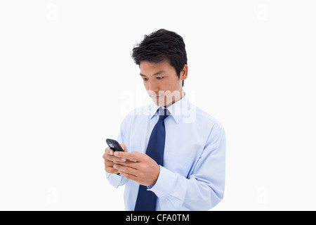Businessman sending a text message Stock Photo