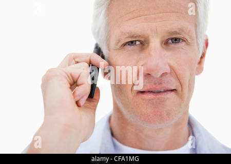 Mature man making a phone call Stock Photo