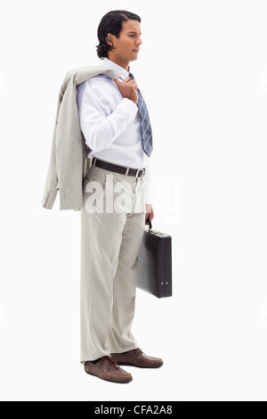Portrait of a serious office worker holding his jacket over his shoulder and a briefcase Stock Photo