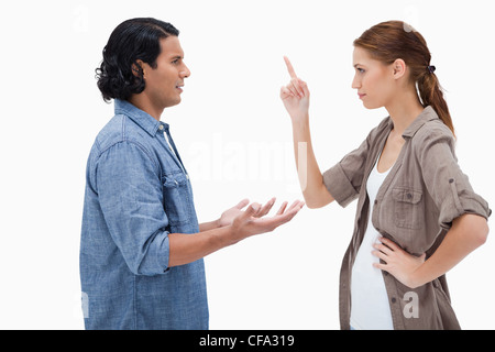 Side view of couple in a tensed conversation Stock Photo