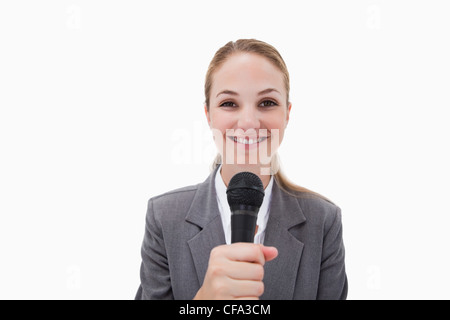 Smiling woman with microphone Stock Photo