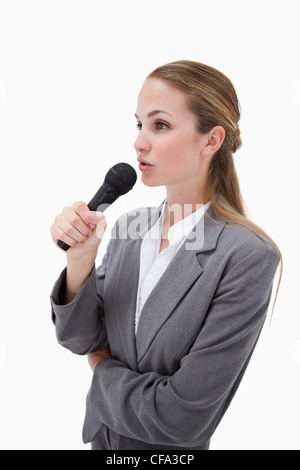 Side view of woman with microphone Stock Photo