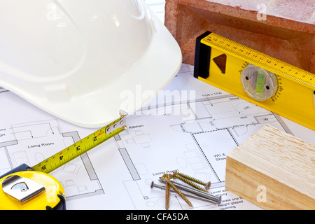 Still life photo of building plans and tools Stock Photo