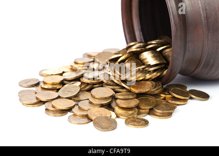 Golden coins falling out from pot close up on white background Stock Photo